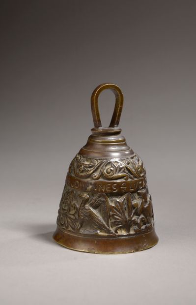 null Bell in bronze with brown patina representing the tetramorph on a background...