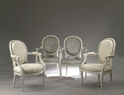 Two armchairs in molded and carved wood,...