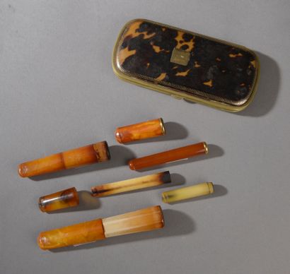 Set includes: 

- A tortoiseshell and brass...