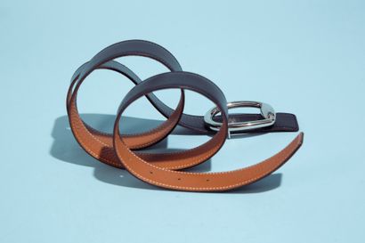 null HERMÈS.
Reversible belt in Togo gold and black box, the buckle in silver metal...