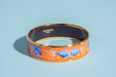null HERMÈS.
Gold-plated metal bracelet with enamelled decoration of Amerindian headdresses...