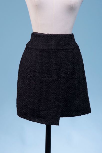 CHANEL. 

Black wool-blend tweed skirt, short...