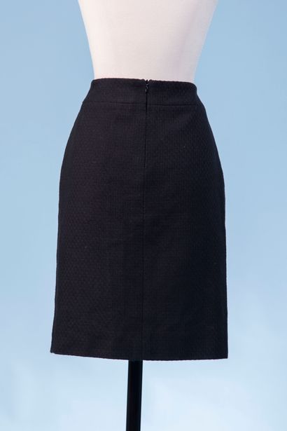 CHANEL Uniform. 

Black cotton tweed skirt,...