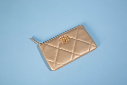 CHANEL. 
Gold quilted leather 