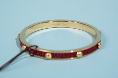 null LOUIS VUITTON. 
Gold-plated metal bracelet, sheathed in burgundy stingray and...