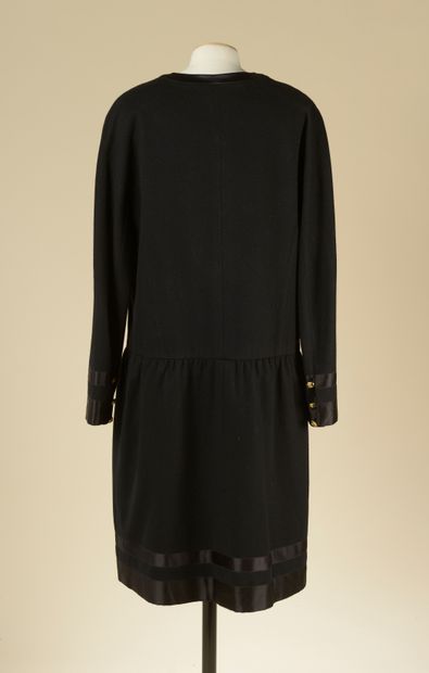 null CHANEL.

Black wool cocktail dress highlighted with black silk braids, straight,...