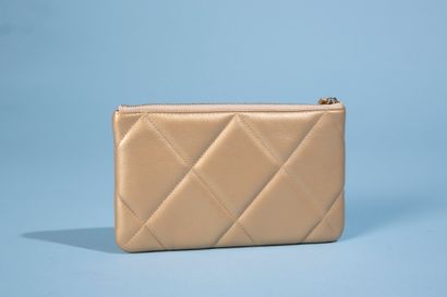 null CHANEL. 
Gold quilted leather "19" clutch bag, applied with the double C in...
