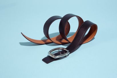null HERMÈS.
Reversible belt in Togo gold and black box, the buckle in silver metal...