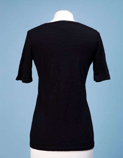 null CHANEL Uniform. 
Black wool sweater, the round neck, short sleeves. 
Uniform...