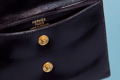 null HERMÈS. 
Black box purse, the clasp with pressure under flap, the interior with...