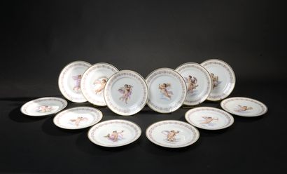 null PARIS.
Twelve white porcelain plates decorated in polychrome with children in...