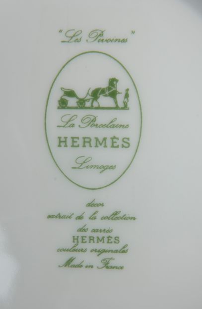null HERMÈS.
Part of a table service in Limoges porcelain model "Les Pivoines" enamelled...