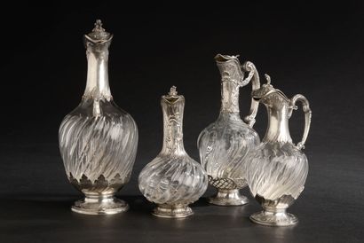null Four different ewers mounted in silver 950 thousandths (Minerve mark), the covered...