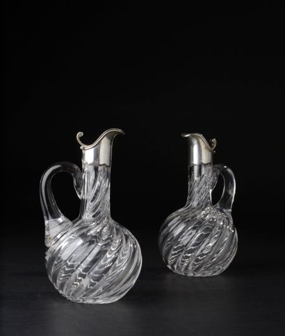 Pair of small crystal pourers cut of twisted...