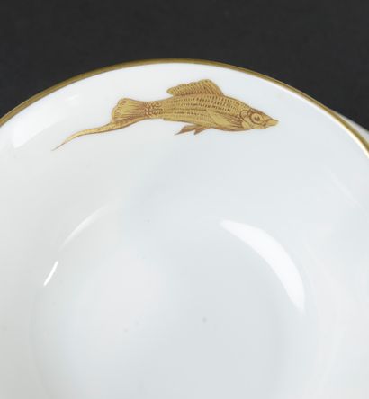 null BERNARDAUD Co, Limoges.
Fish service in white porcelain enamelled with gold...