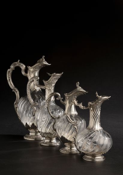 null Four different ewers mounted in silver 950 thousandths (Minerve mark), the covered...