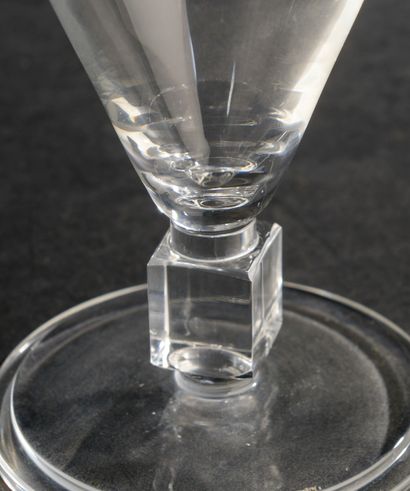 null Crystal glass set in the shape of an inverted cone on a cube, the circular base...