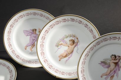 null PARIS.
Twelve white porcelain plates decorated in polychrome with children in...