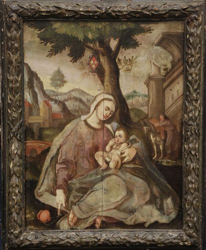 null École flamande du XVIIe siècle.
Vierge à l'enfant dans un paysage architecturé.
Huile...