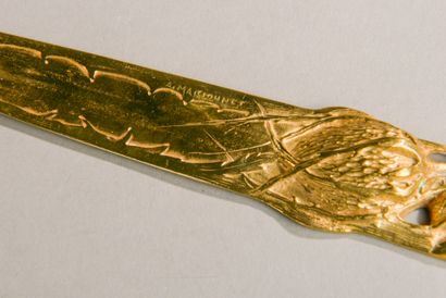 null Albert MARONNIER (1852-1910).
Coupe papier en bronze doré à décor d'une noix,...