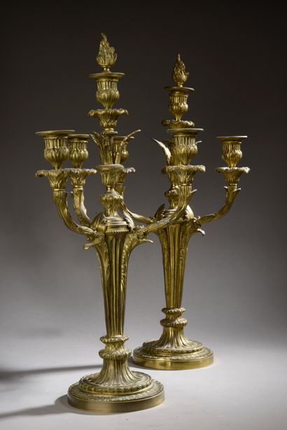 Important pair of candelabras in chased and...