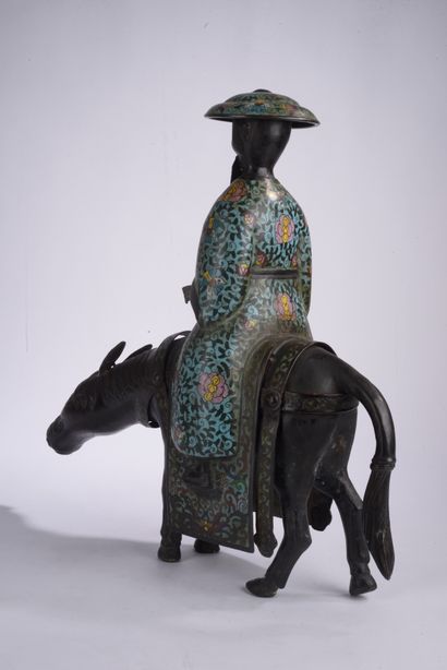 null CHINE - XXe siècle.
Statuette de Toba sur sa mule en bronze et émaux cloisonnés,...