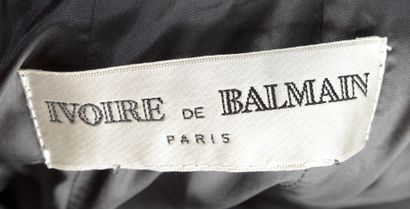 null IVOIRE DE BALMAIN - T. estimée : 34
Jupe midi en laine grise, fermée d'un zip...