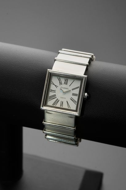 null CHANEL "Mademoiselle".
Steel ladies' wristwatch, square case, white dial with...