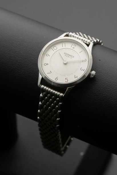 null HERMÈS "Slim".
Ladies' watch in steel, round case, silver dial with Arabic numerals...