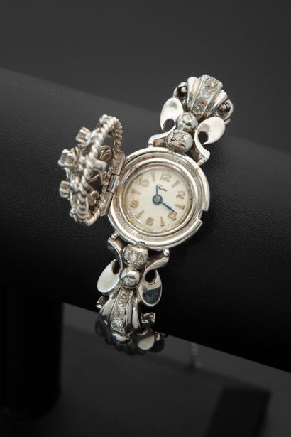 null LUXURY.
Ladies' secret bracelet watch in 18k white gold, the round case covered...