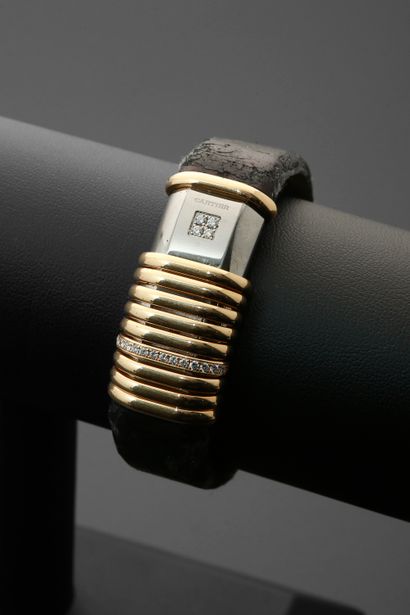 null CARTIER "Declaration".
Ladies' wristwatch in titanium and 18k yellow gold, the...