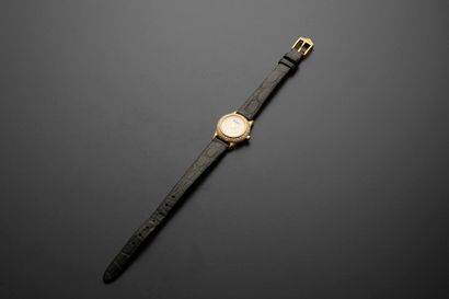 null ALDEBERT.
Ladies' wristwatch in 18k yellow gold, the round case set with round...