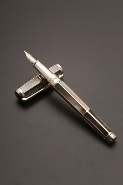 null S.T. DUPONT.
Silver plated or palladium fountain pen, the body set with grey...