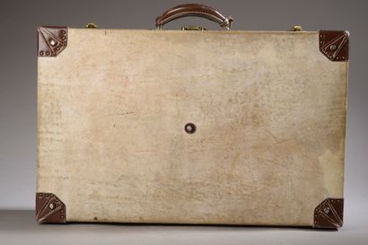 null HERMÈS.
Rectangular rigid suitcase sheathed in parchment monogrammed G.L., one...