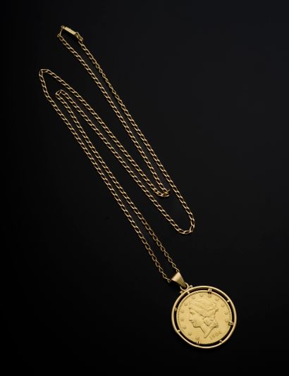 null Pendant in 18k yellow gold presenting a gold coin of 20 American Dollars dating...