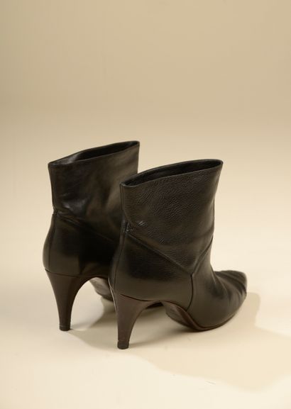 null CHANEL. 
Pair of black grained leather ankle boots, double C stitched toe and...