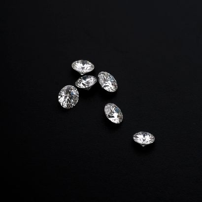 null Set of six modern brilliant-cut diamonds of about 0.30 ct each (one with witness...