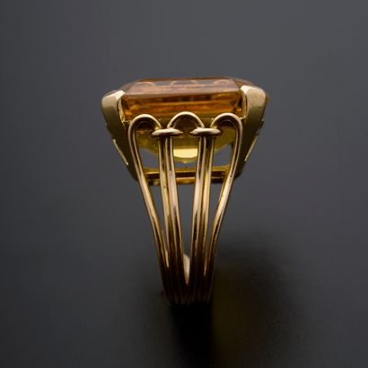 null 18k yellow gold ring set with a large emerald-cut citrine, the ring drawn with...