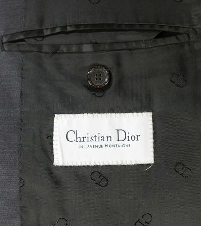 null CHRISTIAN DIOR. 
Three-piece suit in gray wool and silk. The fitted jacket,...