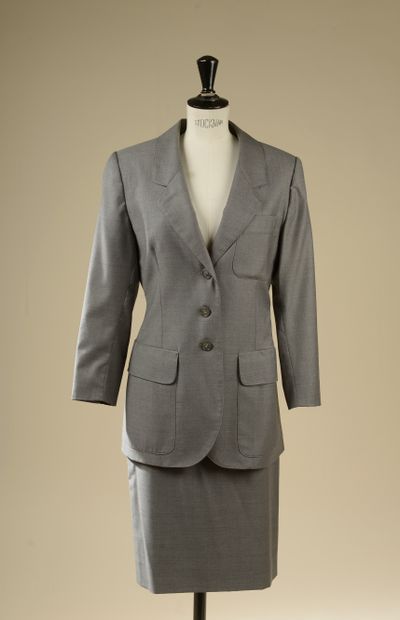 HERMÈS. 
Skirt suit in mottled gray wool....