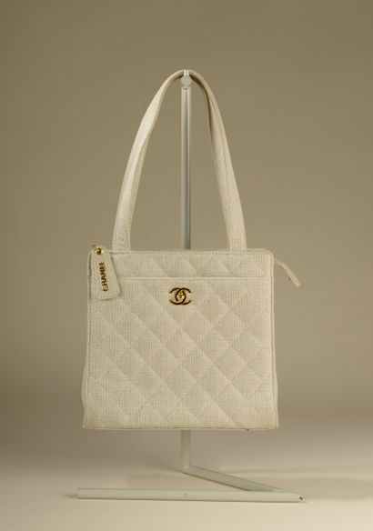 CHANEL. 
Beige quilted canvas bag, two handles...