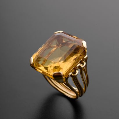 null 18k yellow gold ring set with a large emerald-cut citrine, the ring drawn with...