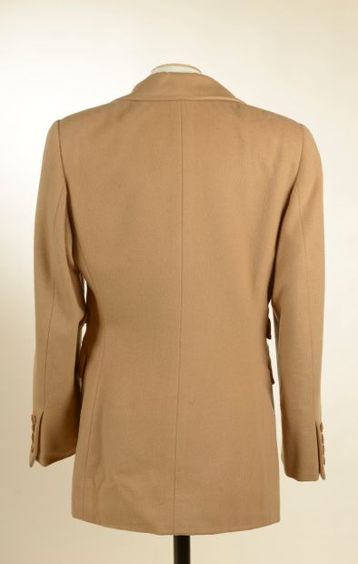null HERMÈS. 
Camel cashmere jacket, notched collar, four flap pockets, closed with...
