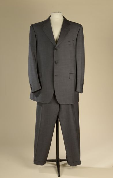 CHRISTIAN DIOR. 
Two-piece suit in gray wool....