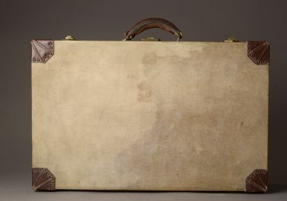 null HERMÈS.
Rectangular rigid suitcase sheathed in parchment monogrammed G.L., one...