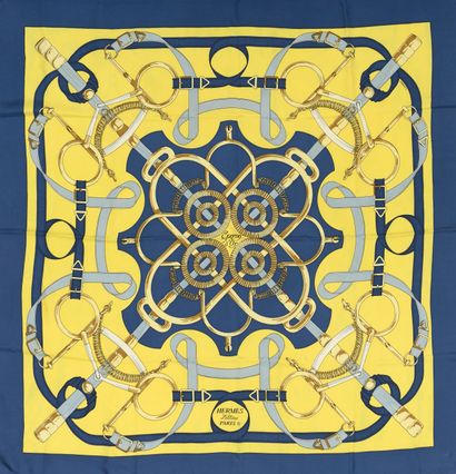 null HERMÈS. 
Silk square "Golden Spurs" decorated in shades of blue and gold on...
