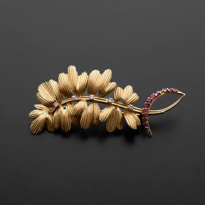 null 18k yellow gold brooch decorated with a flowering branch punctuated with modern...