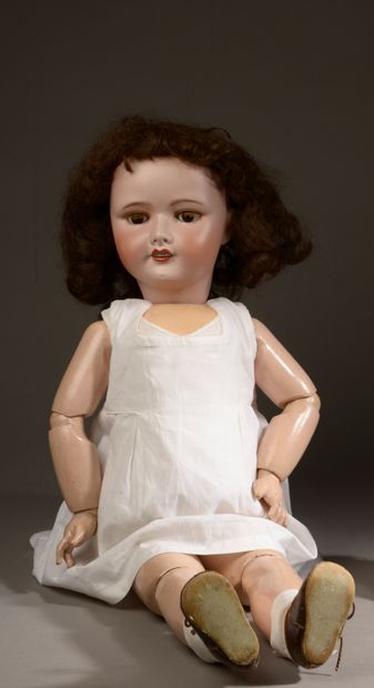 Unis France doll, porcelain head, articulated...