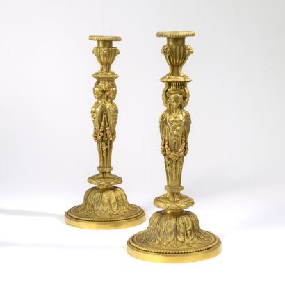 Pair of ormolu torches, the shaft adorned...