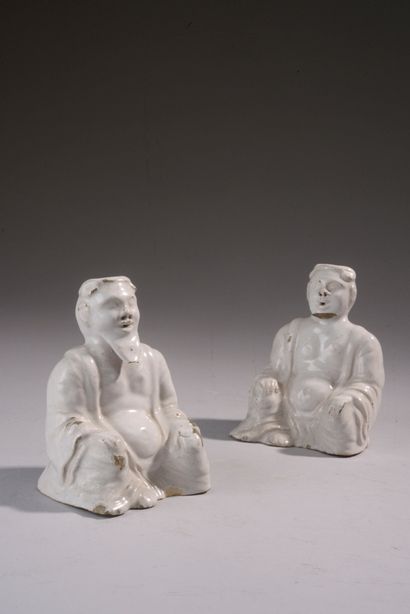 Pair of seated cross-legged figures in white...
